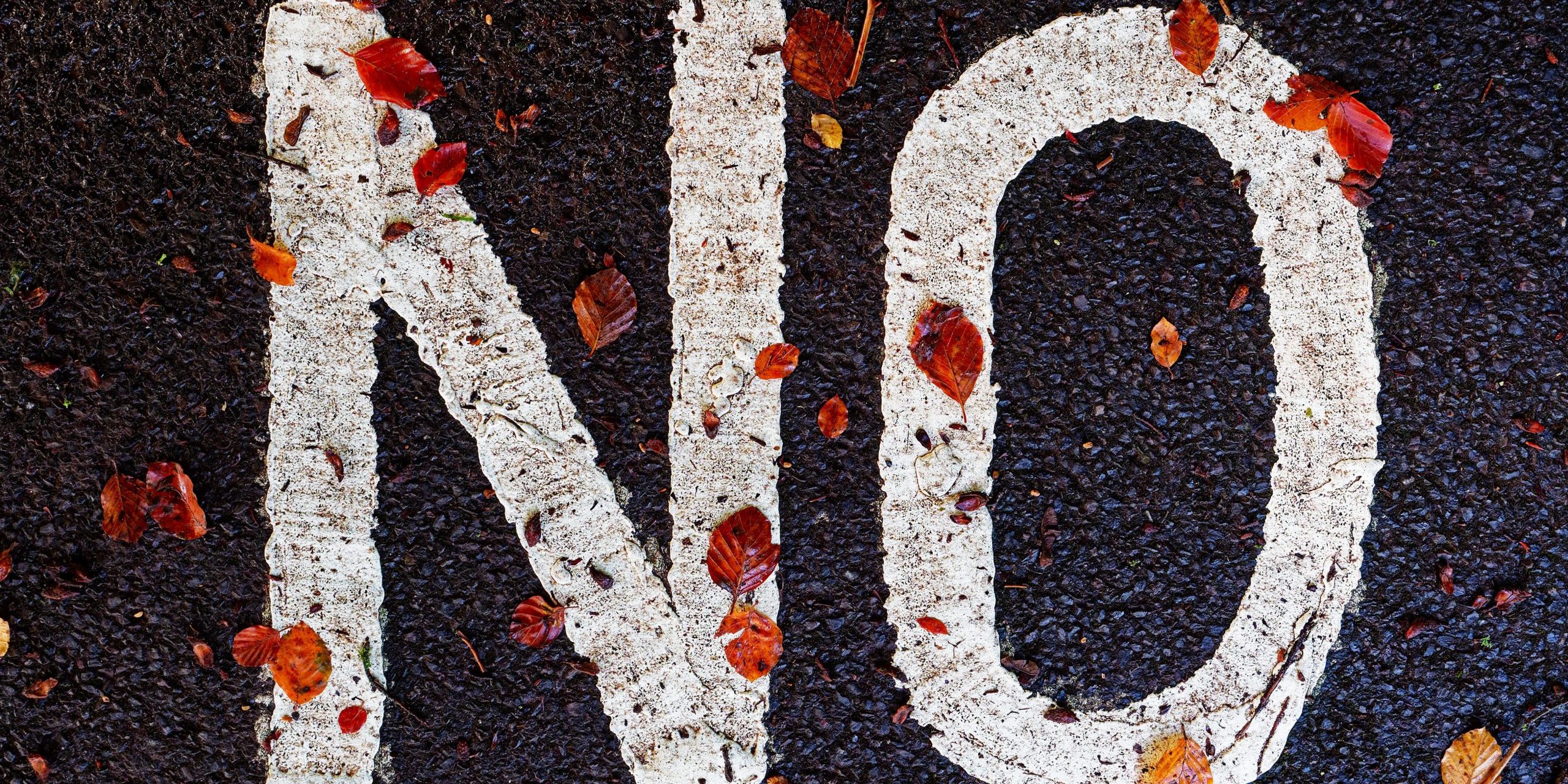'no' painted on a street